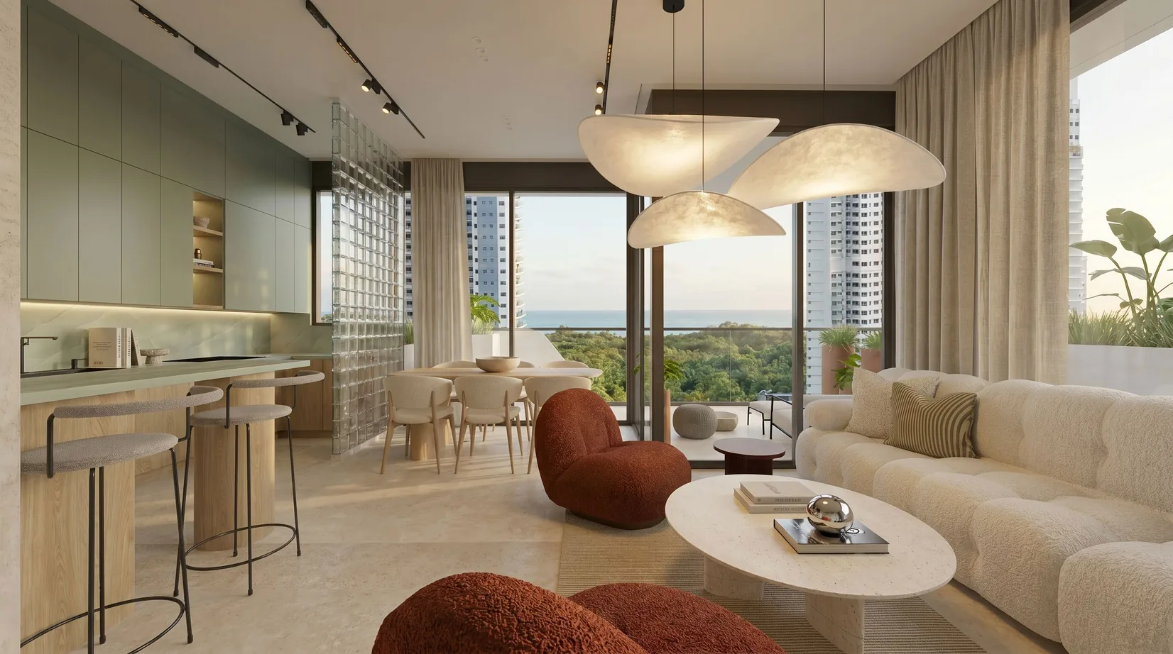 A Selvática living room and kitchen at dusk, sage cabinetry and a glass-block screen, with mangrove canopy, neighbouring towers and the Pacific through full-height glass